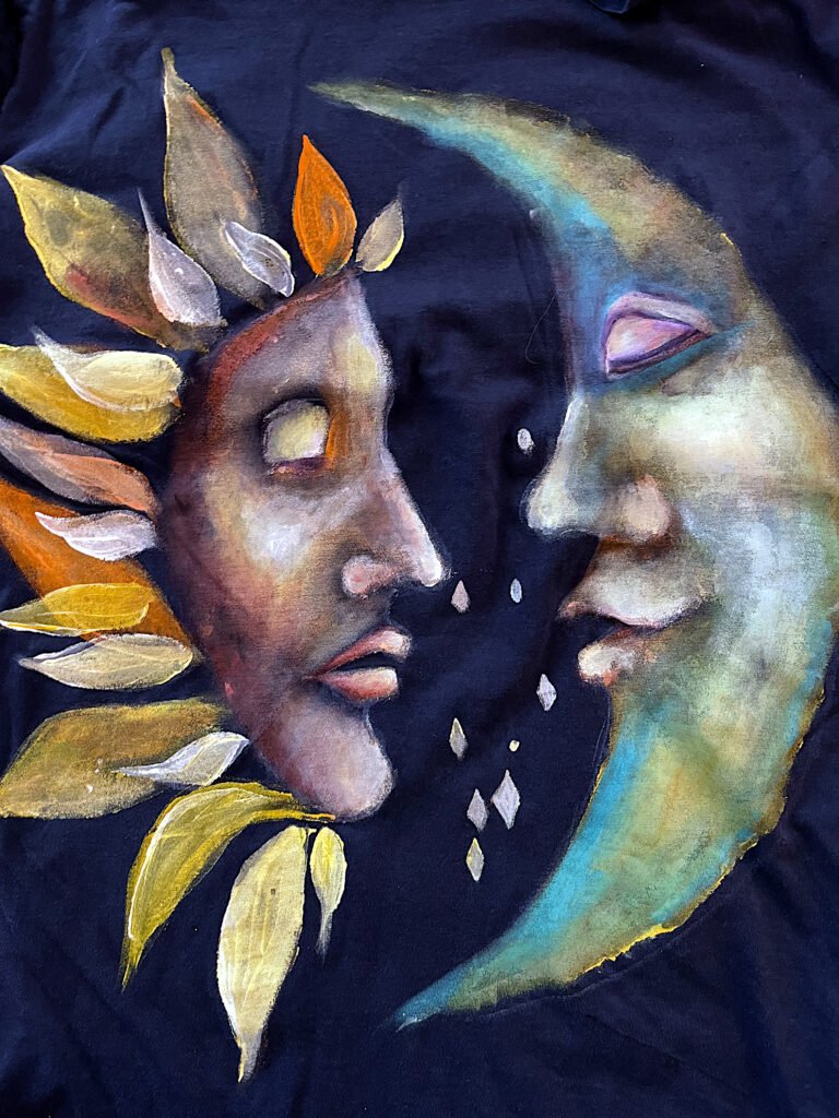 . Hand-painted wearable art with colorful Sun and Moon portrait