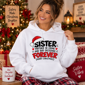 Woman wearing a festive Sister hoodie with humorous “Partner in Crime and Bad Decisions Forever” Christmas typography.