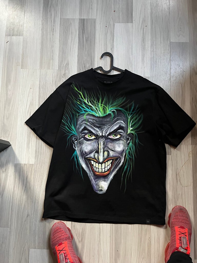 Finished hand-painted black T-shirt with colorful Joker portrait
