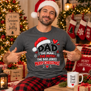 Dad wearing a Christmas T-shirt with humorous “The Man, The Myth, The Bad Jokes” message in festive red, black and white typography.
